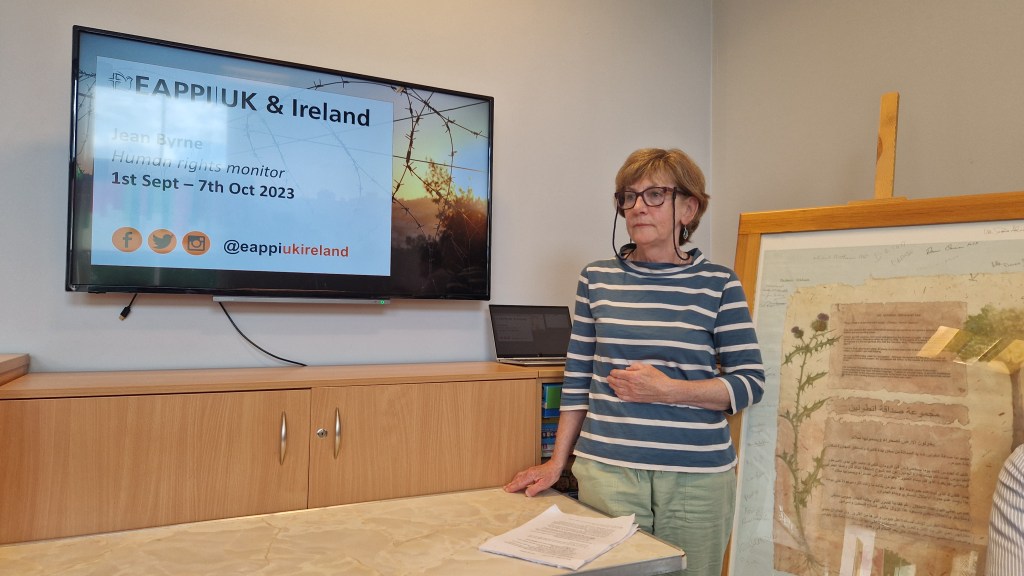 Woman giving presentation at meeting