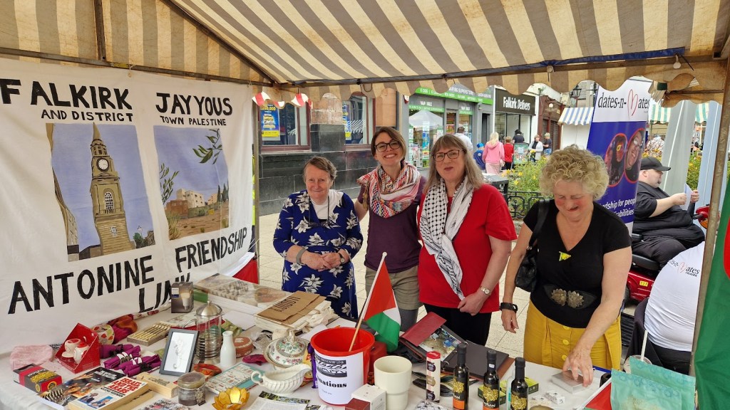 Stallholders at the AFL stall with products